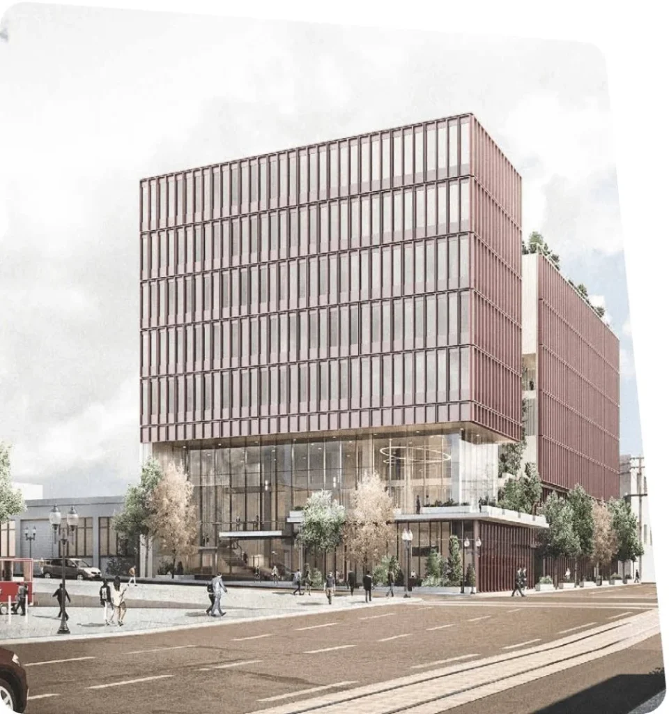 Modern office building with glass facade and urban setting.