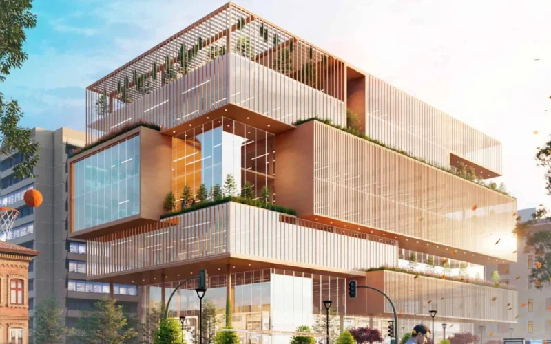 Modern architectural building with glass facade and greenery